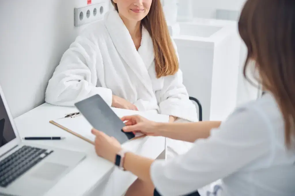 A woman in consultation about SkinVive at 7 Seas Medical Spa in Augusta, GA